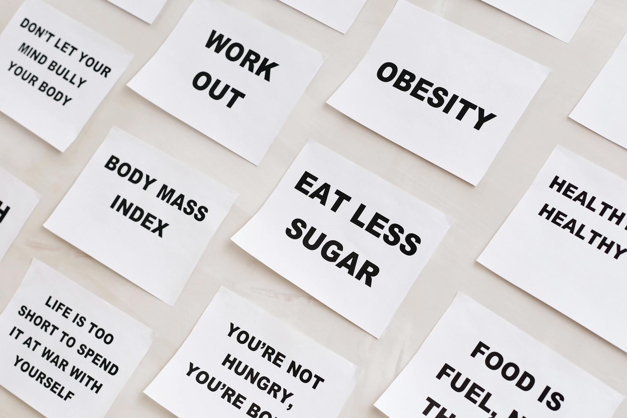 Collection of motivational notes promoting health and wellness found on paper notes.